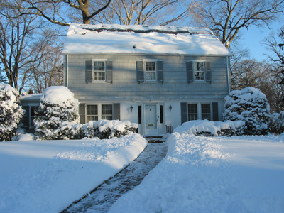 View of House Covered in Snow