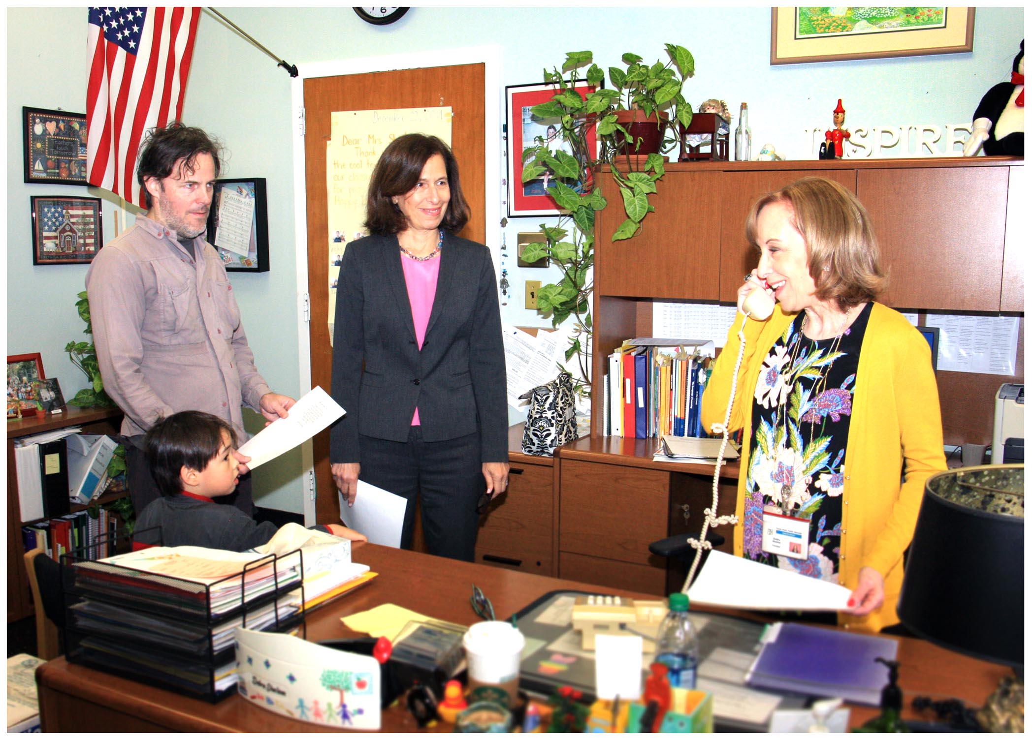 A Parkville School student, his father, Legislator Ellen W. Birnbaum and Parkville School Principal 