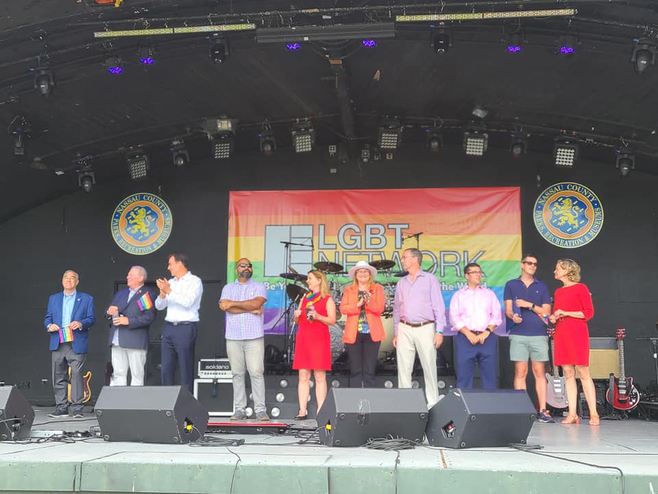 Legislator Drucker pictured second from left, on stage at the Harry Chapin Lakeside Theater
