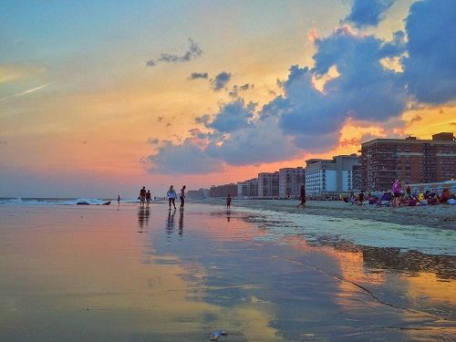 Beach with homes at dusk