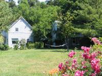 Small white cottage and lawn