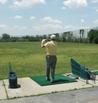 Man at golfing range